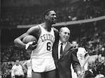 Bill Russell with longtime Boston Celtics head coach Red Auerbach. When Auerbach retired he named Russell to take his place, making him the first Black head coach in the NBA.
