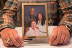 Alan Batts holds a family photo of him with his sister, Karen, and his mother, Elizabeth. Karen Batts died homeless on Portland's streets Jan. 7, 2017, during a winter storm.