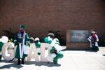 Students pose for pictures on graduation day at Reynolds High School in Troutdale, Ore., in June 2021.