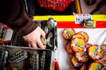 People pick out fireworks at TNT Fireworks stand in Beaverton, Ore., Wednesday, July 3, 2019.