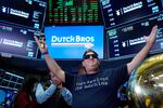 FILE: Dutch Bros Coffee co-founder and Executive Chairman Travis Boersma is shown ringing the ceremonial first trade bell on the floor of the New York Stock Exchange, as his company's IPO opens, Sept. 15, 2021.