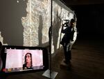 OPB producer Brooke Herbert films Amirra Malak with her immersive video installation at The Ruins in Hood River, Ore.