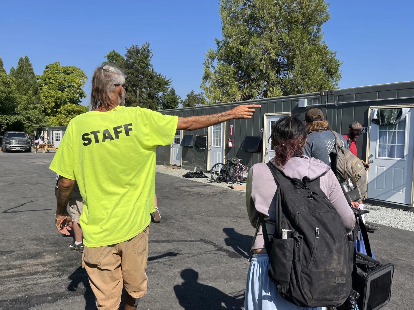 Gary Nichols gives new residents a tour of Parker's Place Village on Aug. 4, 2026.