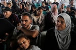 Citizens with foreign passports wait to travel through the Rafah crossing on Thursday. At least 300 civilians, all of them foreign citizens or dual nationals, departed Gaza Wednesday.