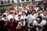 Central Catholic players pose for a photo after winning the Oregon 6A football championship at Hillsboro Stadium in Hillsboro, Ore., Saturday, Dec. 7, 2019. Central Catholic defeated Lake Oswego 49-28.