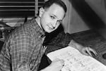 Jules Feiffer at work on proof sheets from his first book, Sick, Sick, Sick in New York in 1958.