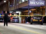 A police officer blocks a downtown Atlanta street following a protest Saturday in the wake of the death of an environmental activist killed after authorities said the 26-year-old shot a state trooper.