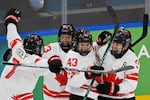 Canada's #43 Kristin O'Neill (2R) celebrates scoring her team's first goal with teammates during the women's gold medal ice hockey match between USA and Canada at the Milano Santagiulia Ice Hockey Arena during the Milan Cortina 2026 Winter Olympic Games.