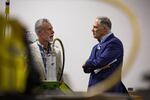 Presidential hopeful and Washington Gov. Jay Inslee, right, speaks with International Brotherhood of Electrical Workers Local 48 business manager Gary Young at the IBEW training center in Portland, Ore., Saturday, March 23, 2019. Inslee is visiting cities across the country as part of the Climate Mission Tour in the early stages of his presidential compaign.