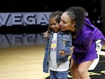 Dearica Hamby poses with her daughter Amaya during a 2022 WNBA championship ring ceremony before the Aces' game against the Los Angeles Sparks in May 2023.