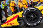 Rubber marks dot the yellow paint of Alex Palou’s winning car. Palou won the race with a time of 1:55:03.