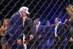 President Donald Trump and first lady Melania Trump stand in the ring at UFC Freedom 250 on the South Lawn of the White House, Monday, June 15, 2026, in Washington.