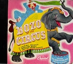 FILE: Pinto Colvig voiced the characters in this Capitol Records book and record set "Bozo at the Circus," published in 1946.