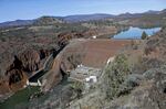 An aerial view of the Iron Gate Dam on the lower Klamath River on a sunny day.