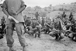 A United States Army adviser (left) leads Salvadoran army soldiers during an open-air class in San Juan Opico, El Salvador, June 20, 1983.