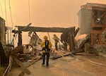 Thurs., Jan. 9: Firefighters work to salvage a home that caught fire on the Pacific Coast Highway.