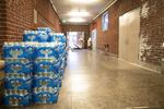 Cases of water bottles line the hallways at Rose City Park school in Portland, Oregon.