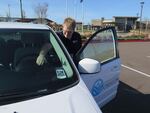 Driver Harrison Hibbert cleans down the van he uses to take veterans to the doctor.