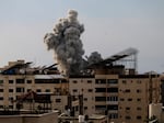 Smoke rises after an Israeli bombardment on October 9 in Gaza City, Gaza.