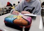 David "DJ" Jennings, 13, works at his desk at Waldo Middle School in Salem, Ore., on May 19, 2025.