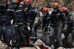 Rescue teams and civil protection members search the rubble for bodies of victims that perished in the devastating earthquake in Imi N'Tala, Morocco, on Sept. 13.