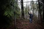 Wes Risher stands next to gymnastics rings on the Portland Exercise Course, an abandoned parcourse in Southwest Portland, Ore., Sunday, Jan. 20, 2019.