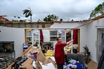 Robert Haight looks around his destroyed house after it was hit by a reported tornado in Fort Myers, Florida, on October 9, 2024, as Hurricane Milton approached.