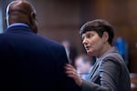 Democratic Oregon state Sen. Elizabeth Steiner Hayward speaks with fellow Democratic Oregon state Sen. James Manning Jr. before the Oregon Senate convenes at the Oregon Capitol in Salem, Ore., Tuesday, April 2, 2019.