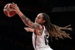 Brittney Griner vies for the ball in the women's final basketball match between the U.S. and Japan during the Tokyo 2020 Olympic Games in August 2021.