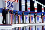 From left, former Arkansas Gov. Asa Hutchinson, former New Jersey Gov. Chris Christie, former Vice President Mike Pence, Florida Gov. Ron DeSantis, businessman Vivek Ramaswamy, former U.N. Ambassador Nikki Haley, Sen. Tim Scott, R-S.C., and North Dakota Gov. Doug Burgum before a Republican presidential primary debate hosted by FOX News Channel Wednesday in Milwaukee.