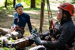 Chad Marks-Fife, left, and Megan Schaap debrief after a difficult climbing exercise on June 15, 2023.