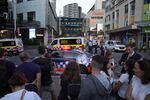 A crowd gathers outside Westfield Shopping Centre in Sydney on Saturday, April 13, 2024.