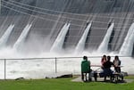 FILE - Water is released through the outlet tubes at Grand Coulee Dam, Wash., on the Columbia River on June 1, 2011.