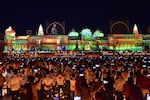 People watch a light show on the banks of river Sarayu on the eve of Diwali, the Hindu festival of lights, in Ayodhya on Oct. 23, 2022.