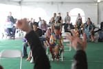 A crowd cheers on the participants in a game of musical chairs at the 2026 Ko-Kwel Salmon Celebration.