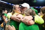 Oregon star Sabrina Ionescu hugs her parents after leading the Ducks to their first women's Elite Eight victory in program history Sunday, March 31, 2019. 