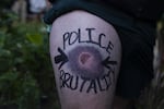 A man who says Portland police shot him in the leg at close range with a 40mm foam munition shows the bruise it left during the sixth night of protests over the killing of George Floyd, a Black man from Minneapolis who was killed after an officer pushed his knee into his neck for nearly nine minutes.
