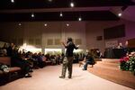 Philip J. Wolfe signs his testimony during a community listening session at Maranatha Church in Portland, Ore., Thursday, Feb. 21, 2019. City leaders called the meeting to hear community concerns over a police lieutenant's text messages with Patriot Prayer leader Joey Gibson.