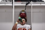 Central Catholic player Izaya Shabazz (58) stays hydrated during halftime. The Central Catholic Rams played the Lake Oswego Lakers at Hillsboro Stadium in Hillsboro, Oregon, on Dec. 7, 2019. The Rams defeated the Lakers 49-28.