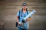 Wielding the "insectazooka," Cecilia González prepares to collect mosquitoes from a house in the village of Los Encuentros, Guatemala.