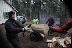 Volunteers help haul wood during the first weekend of each October.