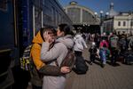 A mother embraces her son who escaped the besieged city of Mariupol and arrived at the train station in Lviv, western Ukraine on Sunday, March 20, 2022.
