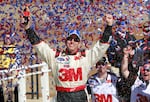 FILE - Greg Biffle celebrates in victory lane after winning the NASCAR Sprint Cup Series auto race at Kansas Speedway on Sunday, Oct. 3, 2010, in Kansas City, Kan.
