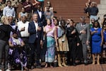 Mayor Ted Wheeler and other city officials stand for the National Anthem at Pioneer Courthouse Square during a press conference to denounce violence Aug. 14, 2019.