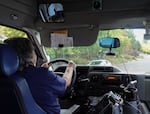 Sheryl Hubbard drives a shuttle bus in La Grande, Ore., on Sept. 30. She is one of the many residents who oppose a local gas tax measure.