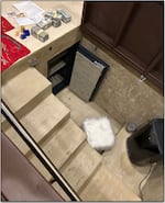 At Eva García de Joaquín’s home, law enforcement officers found a trap door in a bedroom that concealed an underground safe and a dehumidifier. The safe held large amounts of cash along with gold coins and a USB drive, prosecutors say.