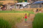 A child dances and sings while running through an IDP camp for Rohingya refugees outside of Cox's Bazar, Bangladesh on October 12, 2017.