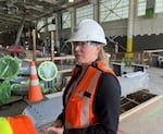 Amtrak Executive Vice President Laura Mason guided reporters through the new, under-construction Seattle rail yard revamp, which she said “will enable modern, more efficient maintenance practices.”