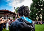 A young violinist performs at the violin vigil for Elijah McClain at Peninsula Park in Portland, Ore., Friday, July 3, 2020. The crowd was a mix of young and old, with some musicians who had not touched their instruments in years. Nearly 100 string players came out to play that evening.