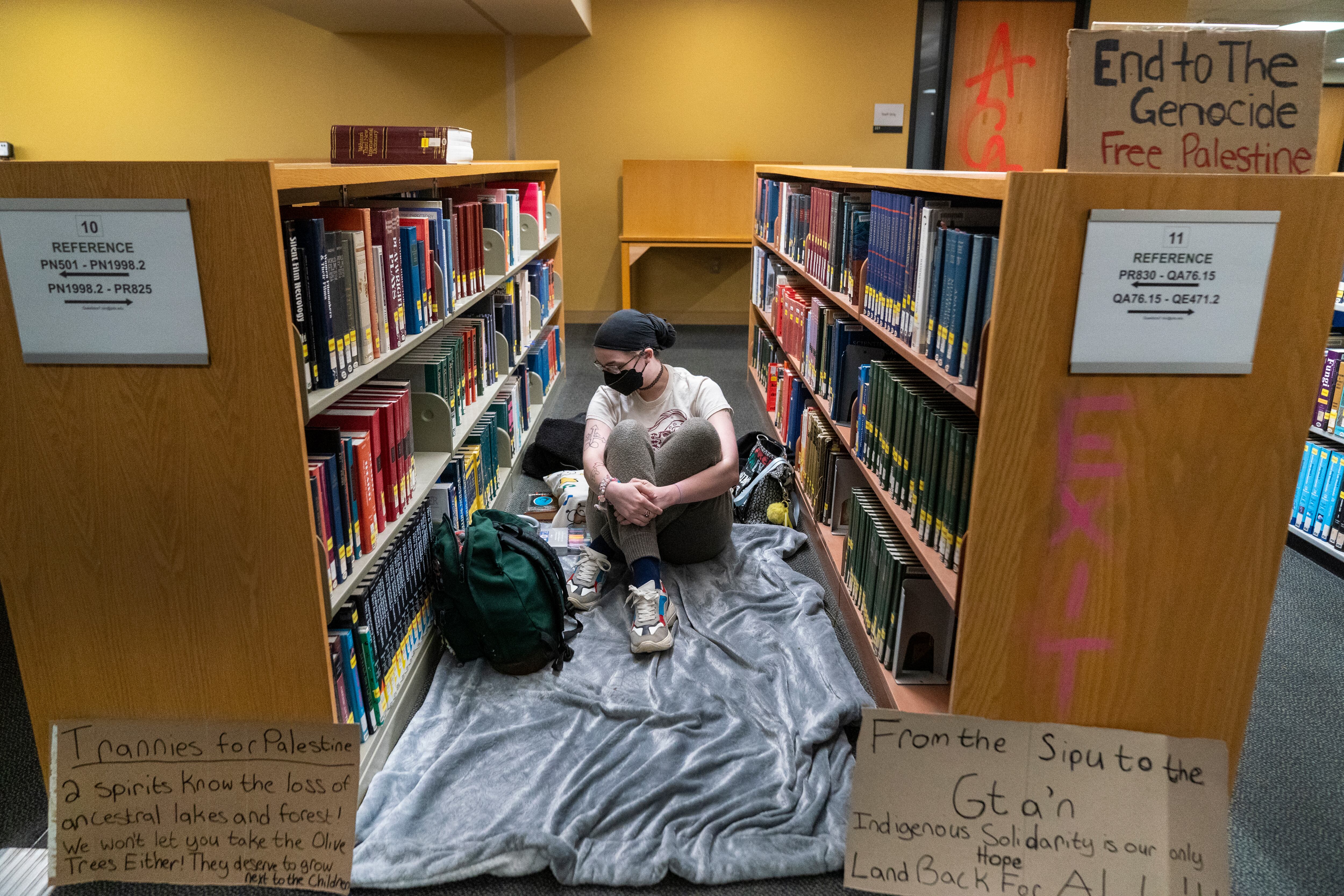 A person prepares to rest for the evening in the library, seen during a tour inside the Branford Price Millar Library at Portland State University, April 30, 2024. Police plan to clear protesters from inside and outside the library Thursday morning. People opposed to Israel's war in Gaza have occupied the library since Monday evening.